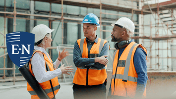 three workers discuss their safety of culture