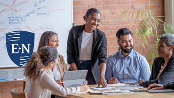 Employees in a meeting about employee retention strategy.