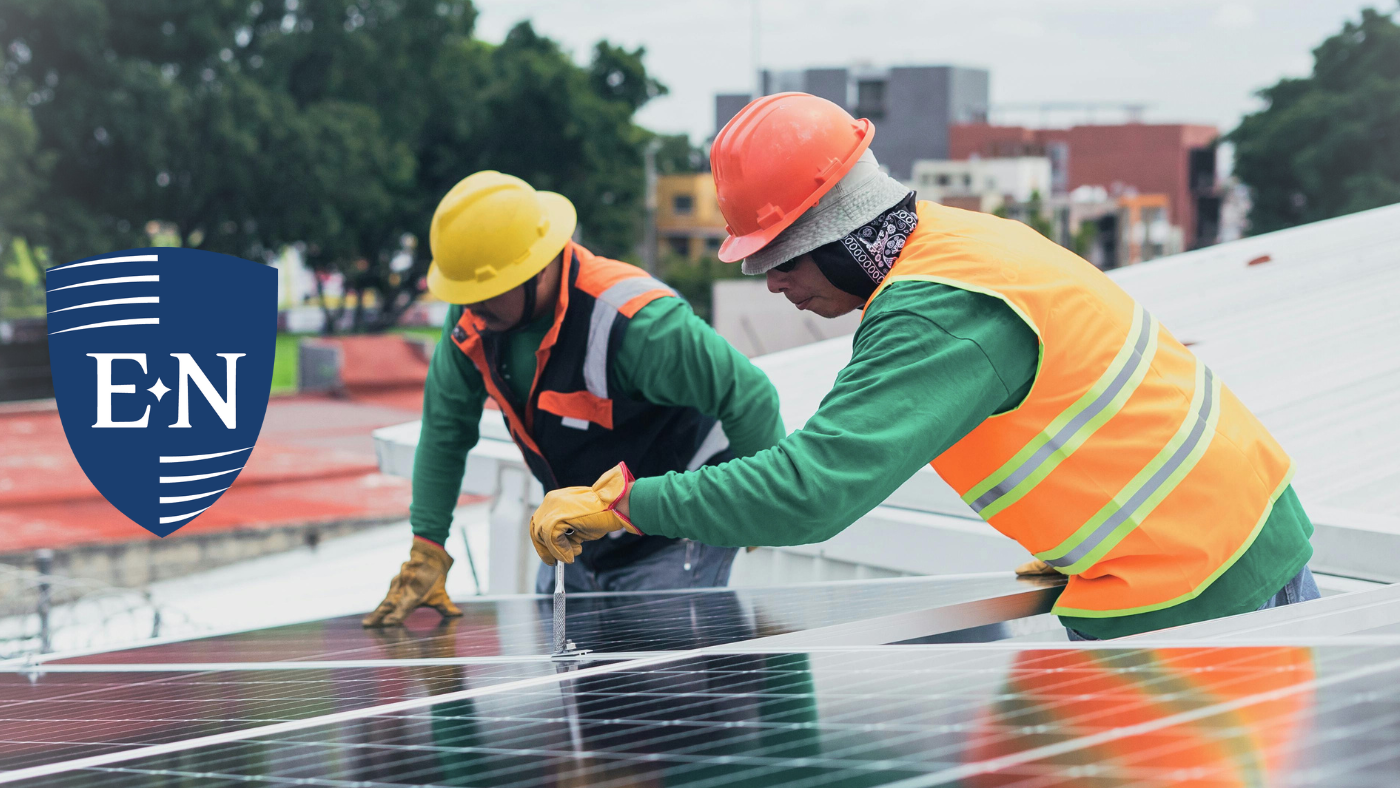 Two men installing solar panels for a company that provides small employee benefits.