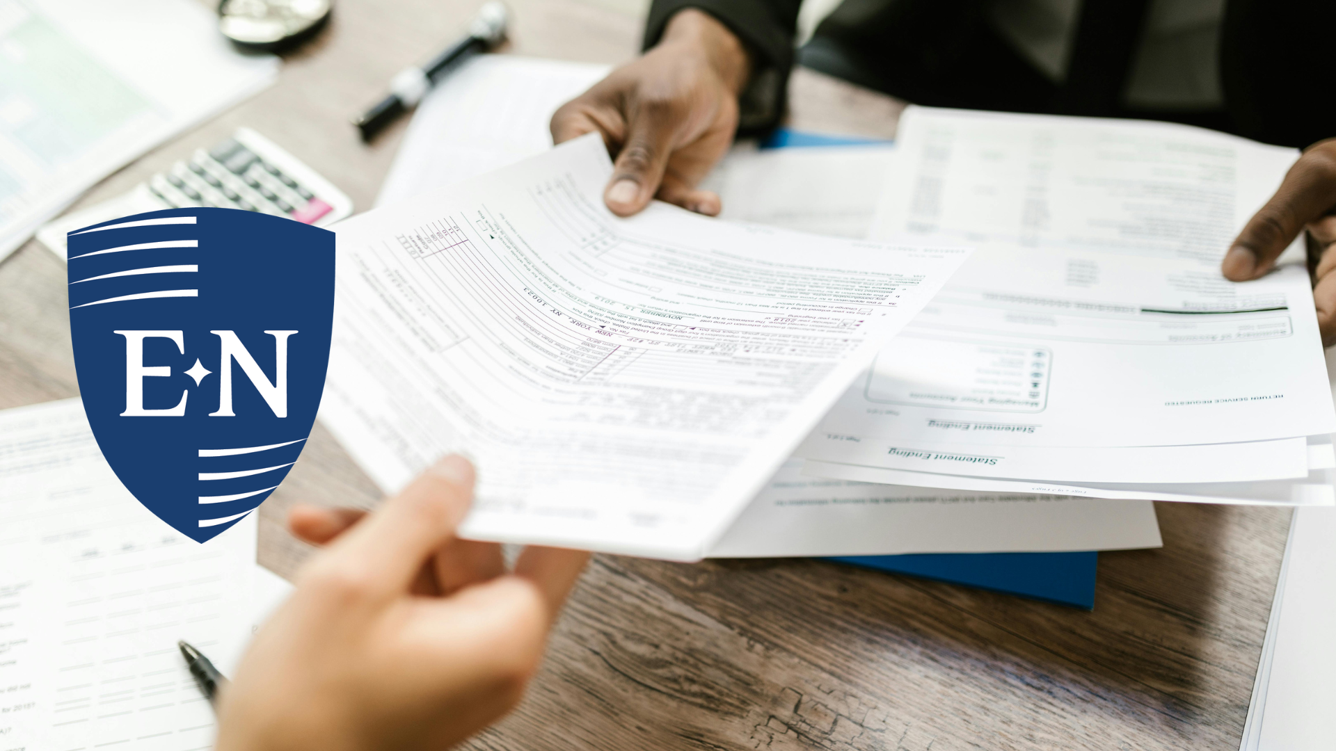 Two people reviewing personal idemnity insurance documents.