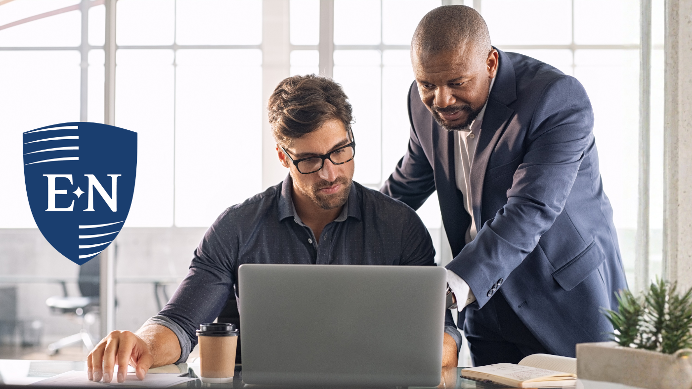 Two people discussing leadership development strategies.